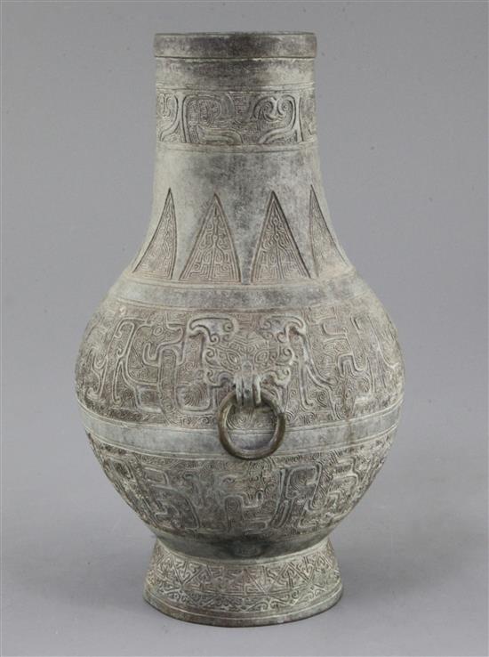 A Chinese archaic bronze ritual wine vessel, Hu, Eastern Zhou dynasty, 5th-3rd century B.C., 24cm high, small hole